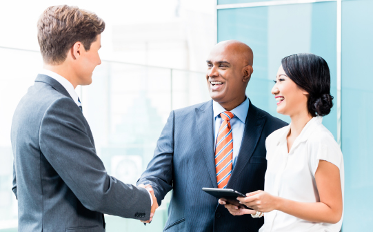 Photo of employees shaking hands